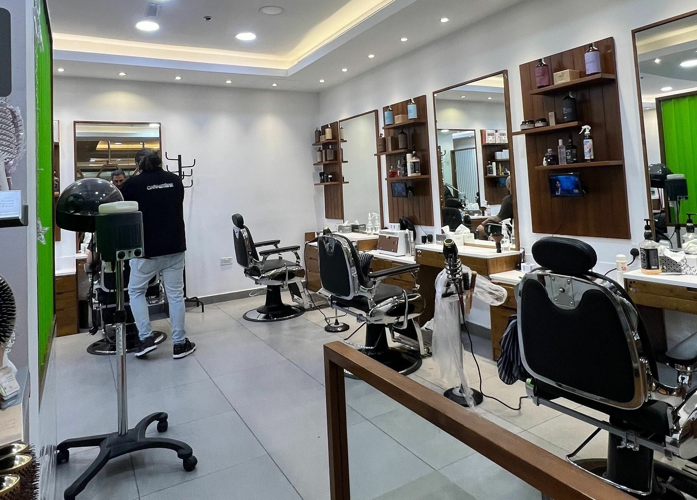 Modern salon chairs and mirrors at Caractere Salon Mall of the Emirates, Dubai, AE.