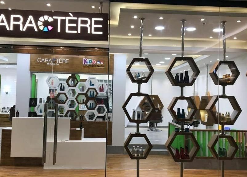 Modern interior of Caractere Salon Mall of the Emirates, Dubai, AE with chic hexagonal shelving displays.
