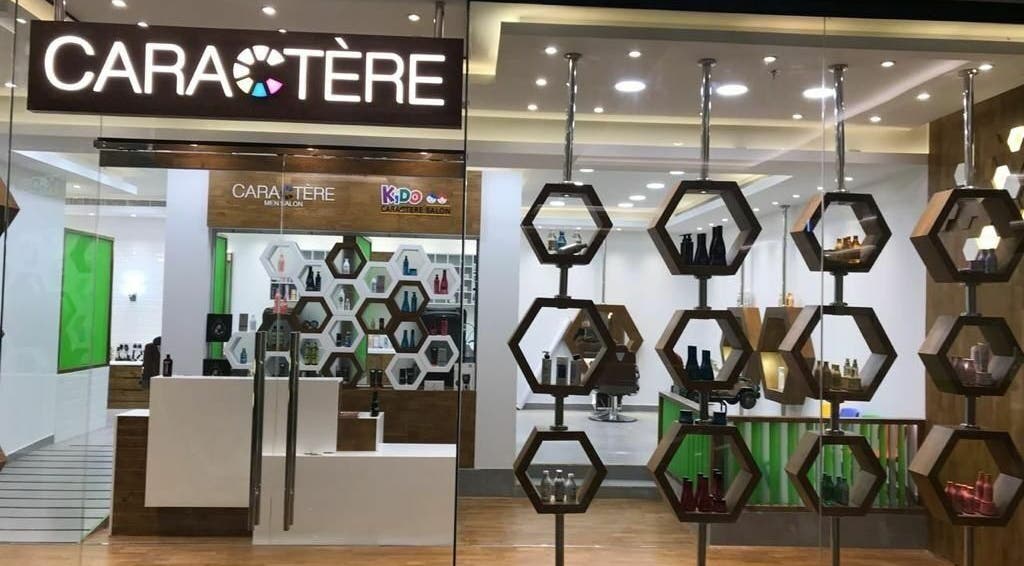 Modern interior of Caractere Salon Mall of the Emirates, Dubai, AE with chic hexagonal shelving displays.