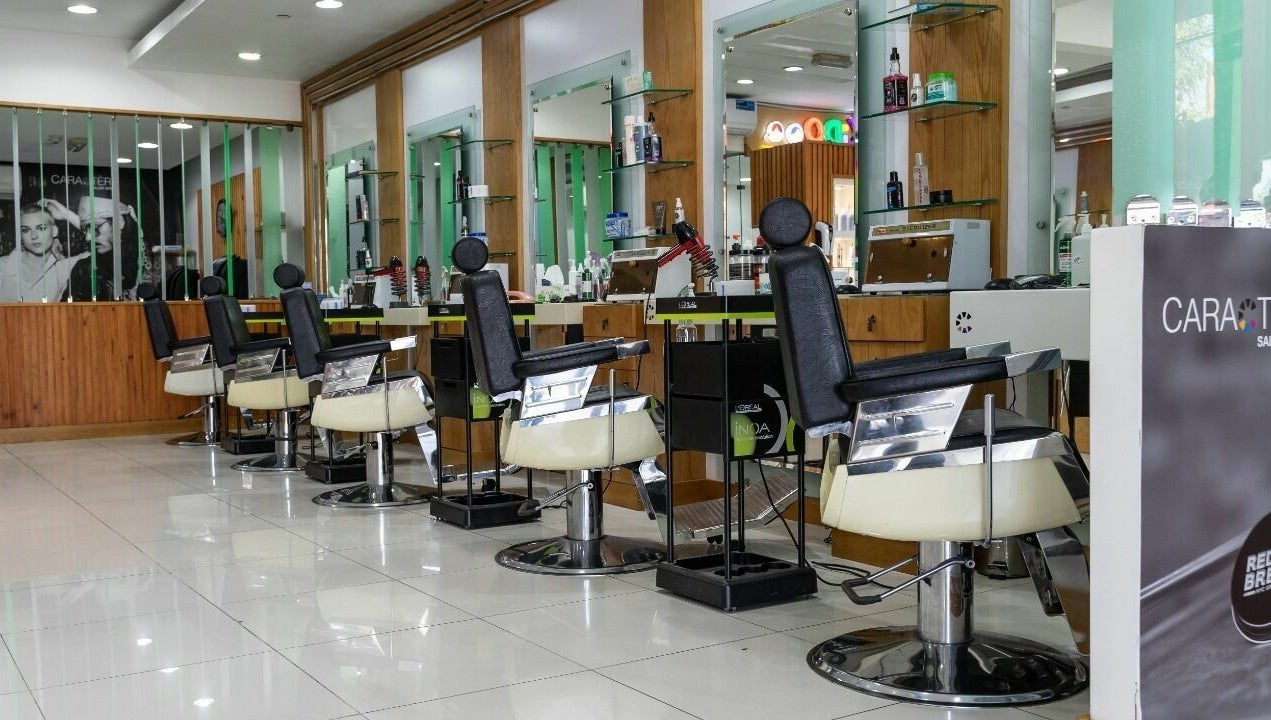 Caractere Salon -كاريكتير - Motor City in Dubai, AE features modern styling chairs and sleek decor.
