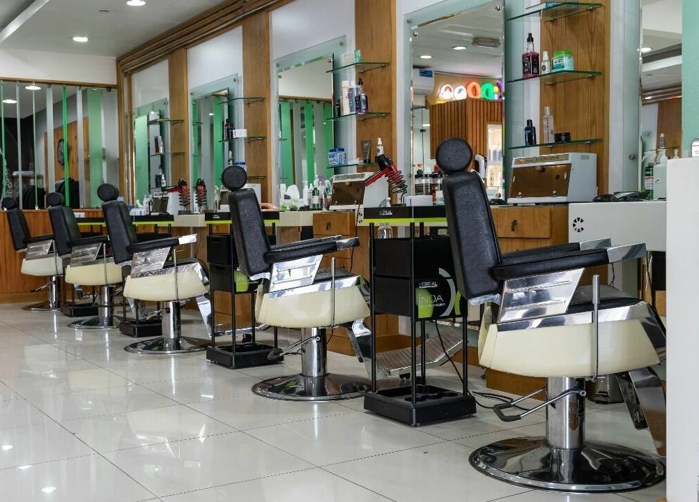 Caractere Salon -كاريكتير - Motor City in Dubai, AE features modern styling chairs and sleek decor.
