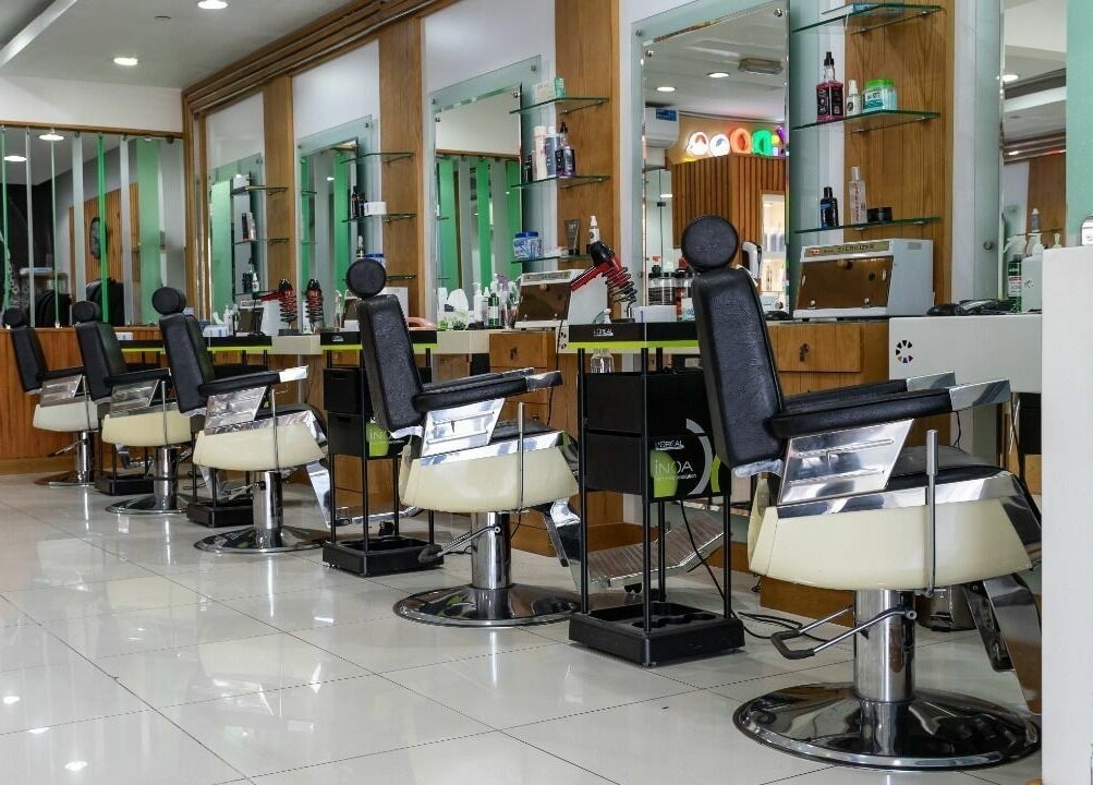 Caractere Salon -كاريكتير - Motor City in Dubai, AE features modern styling chairs and sleek decor.