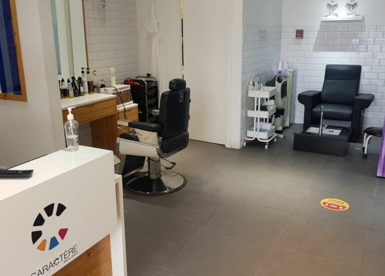 Interior of Caractere Remraam Gents in Dubai, AE showcasing barber and pedicure chairs.