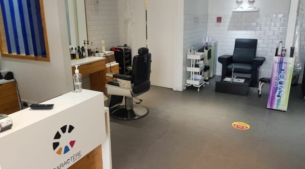 Interior of Caractere Remraam Gents in Dubai, AE showcasing barber and pedicure chairs.