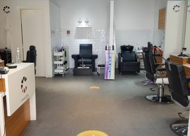 Modern interior of Caractere Remraam Gents salon in Dubai, AE with stylish barber chairs and sleek decor.