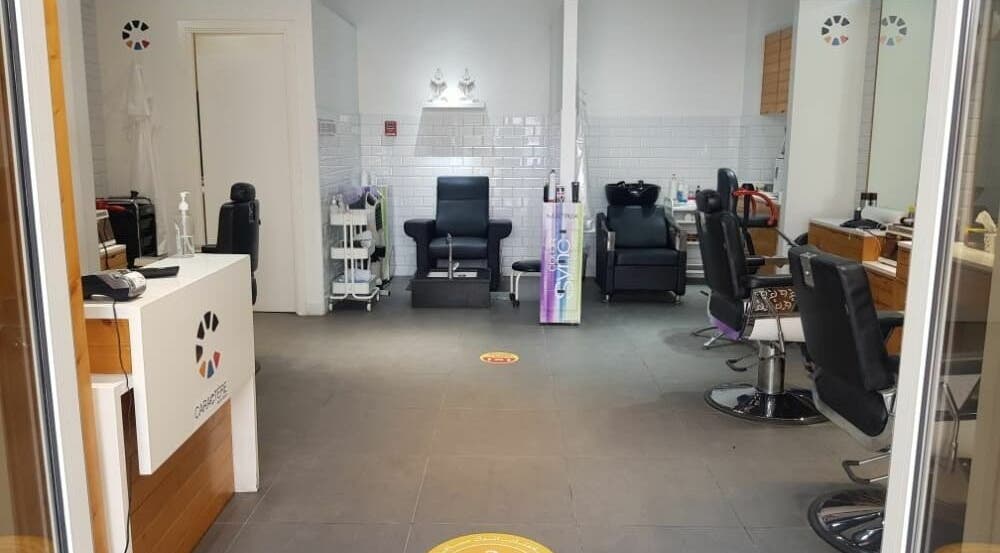 Modern interior of Caractere Remraam Gents salon in Dubai, AE with stylish barber chairs and sleek decor.