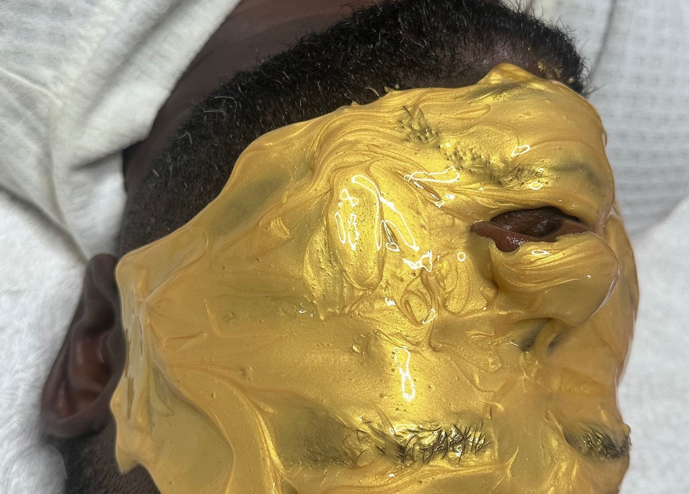 Relaxing golden facial mask applied at CBL New York Location, Albany, New York, US for ultimate skincare.