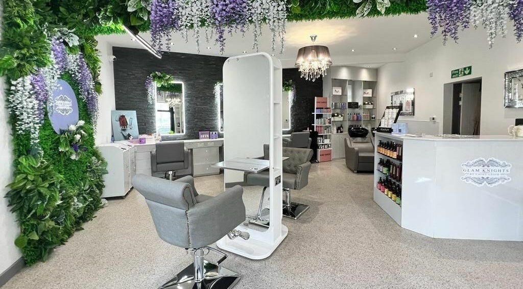 Luxurious salon interior at Glam Knights, Bolton, England with stylish chairs and elegant decor.
