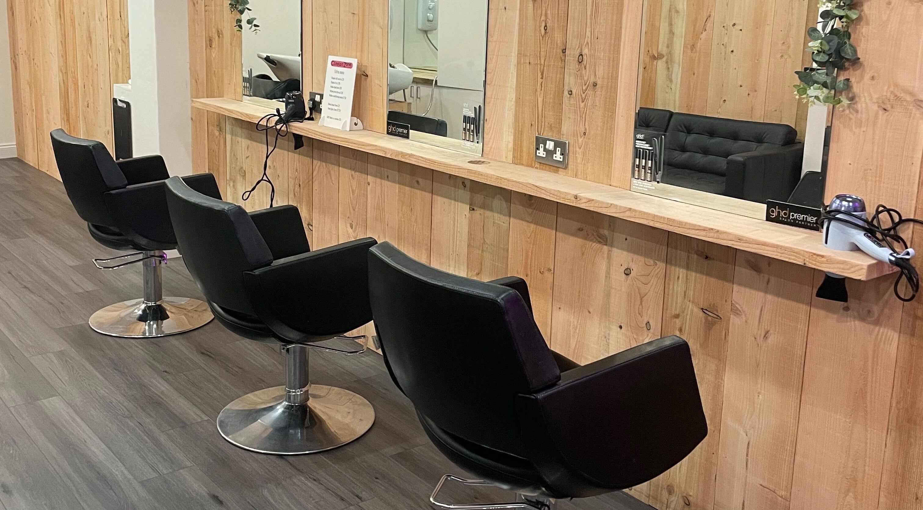 Modern salon chairs and mirrors at The Comfort Zone, Truro, England, GB. Elegantly designed beauty space.