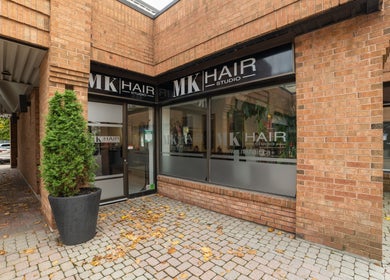 Entrance of Mk Hair Studio with modern glass windows in Mississauga, Ontario, CA.