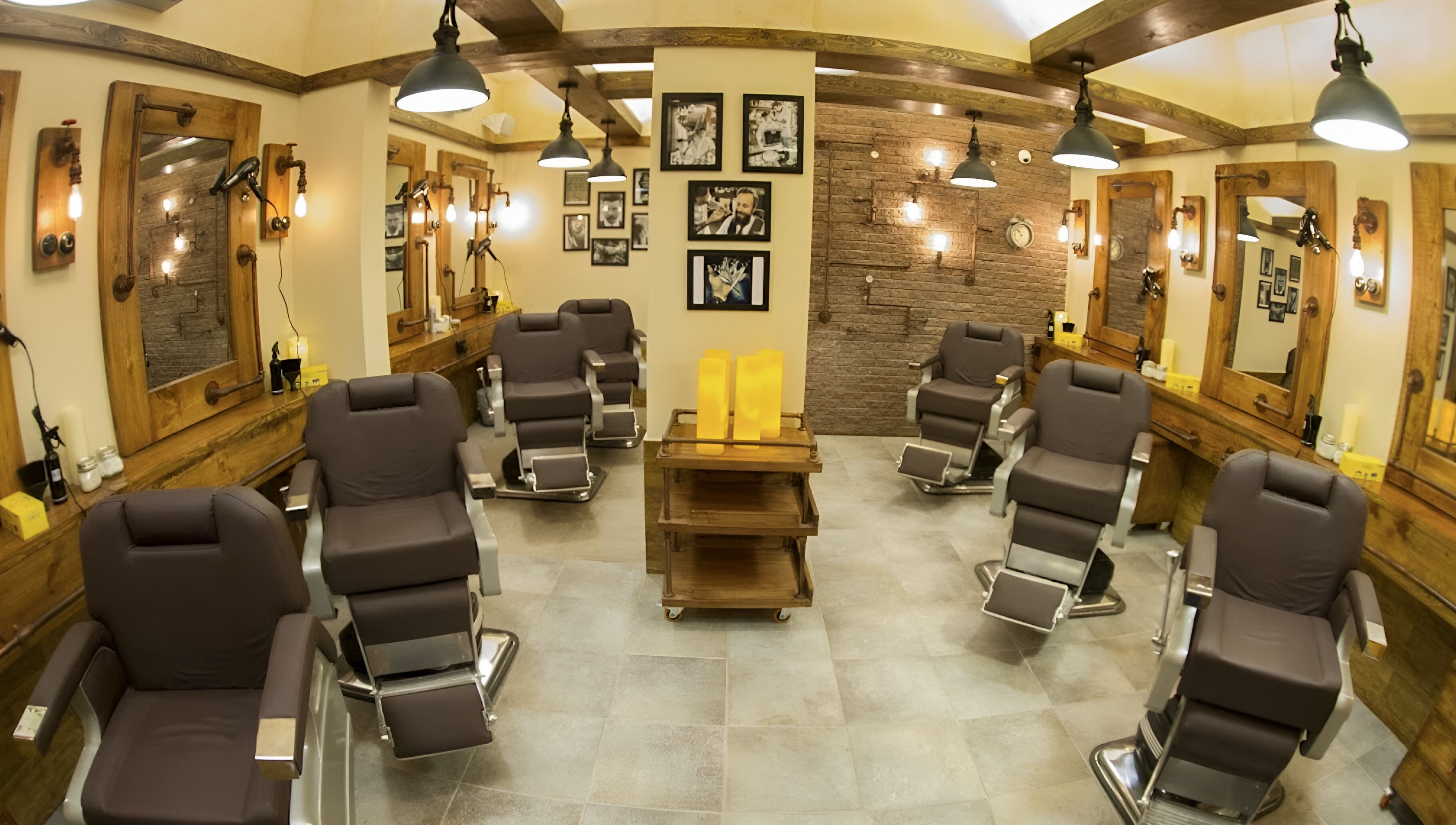 Interior of Clippers Salon Zamzama Branch, Karachi, Sindh, PK, featuring chic barber chairs and rustic decor.