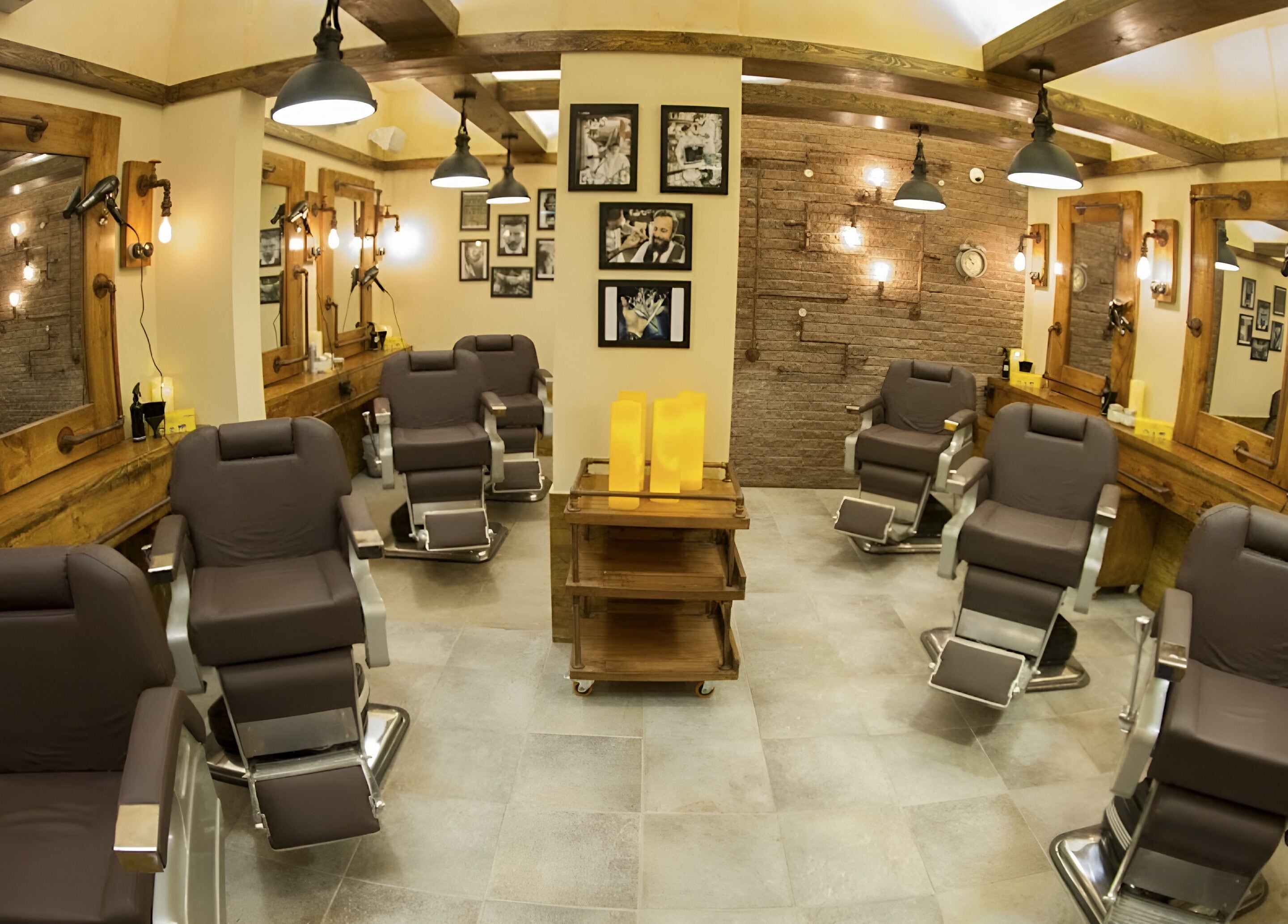 Interior of Clippers Salon Zamzama Branch, Karachi, Sindh, PK, featuring chic barber chairs and rustic decor.