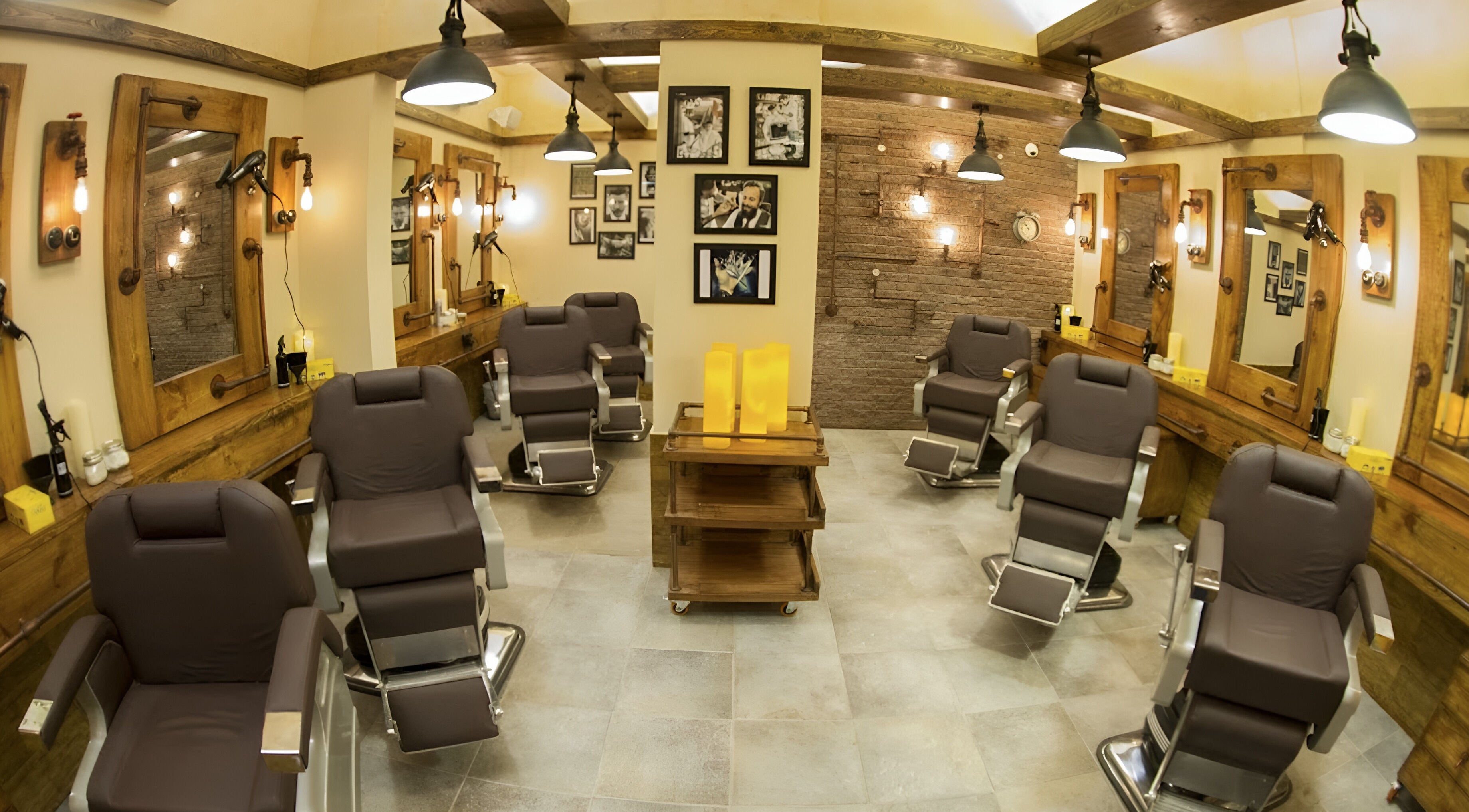 Interior of Clippers Salon Zamzama Branch, Karachi, Sindh, PK, featuring chic barber chairs and rustic decor.