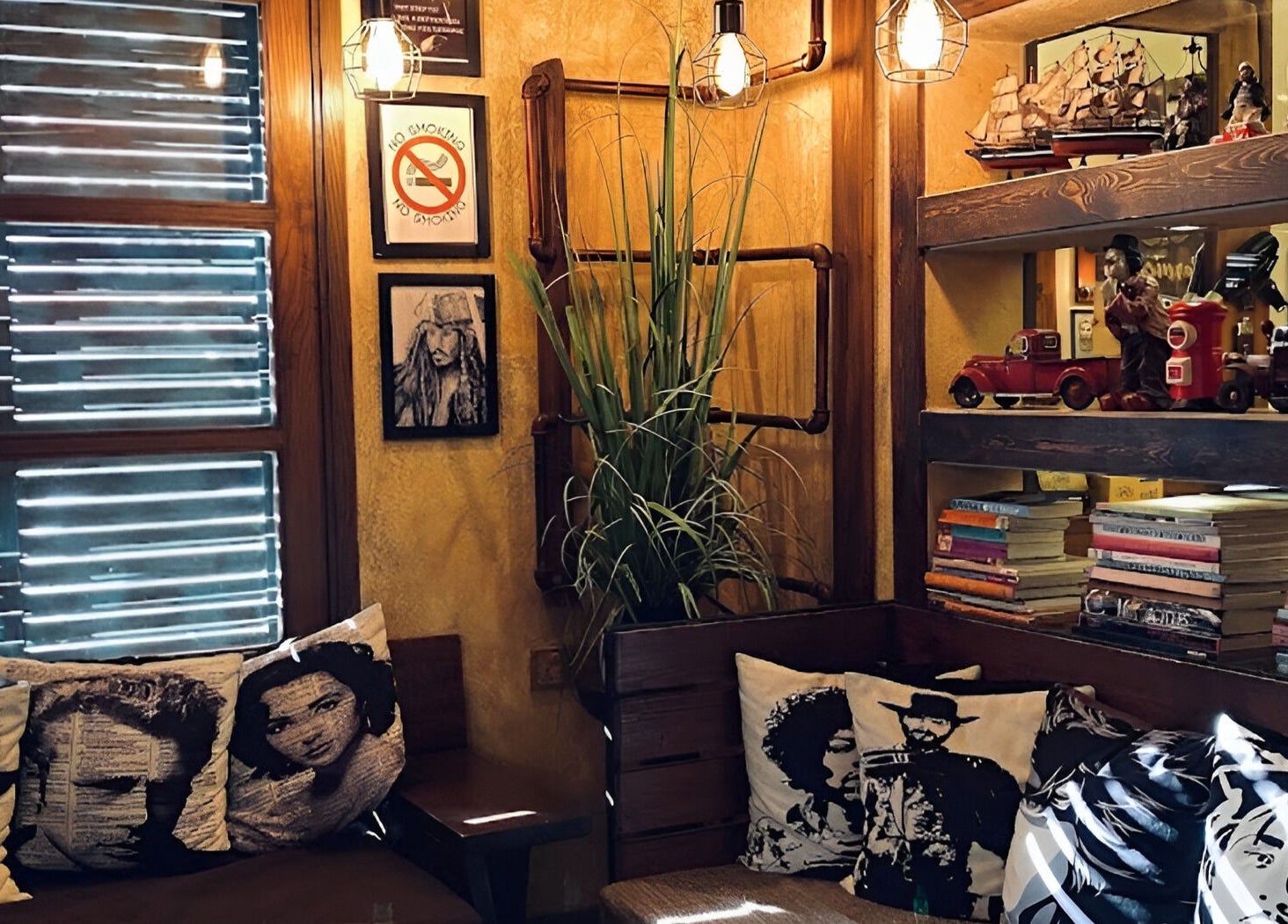 Charming vintage decor at Clippers Salon Zamzama Branch, Karachi, Sindh, PK, with cushions and vintage toys.