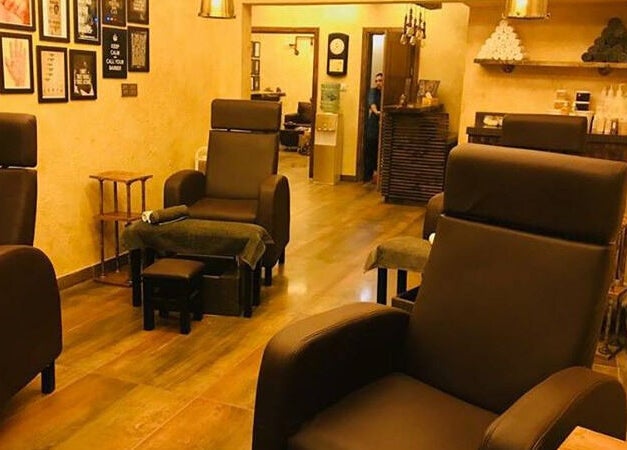 Luxurious brown salon chairs at Clippers Salon Zamzama Branch, Karachi, Sindh, PK offering a serene ambiance.