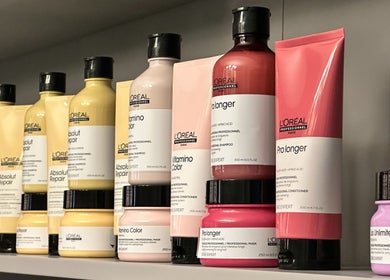Premium hair care products on display at Fetouna Women Salon, Dubai, AE. Shelf stocked with L'Oreal items.