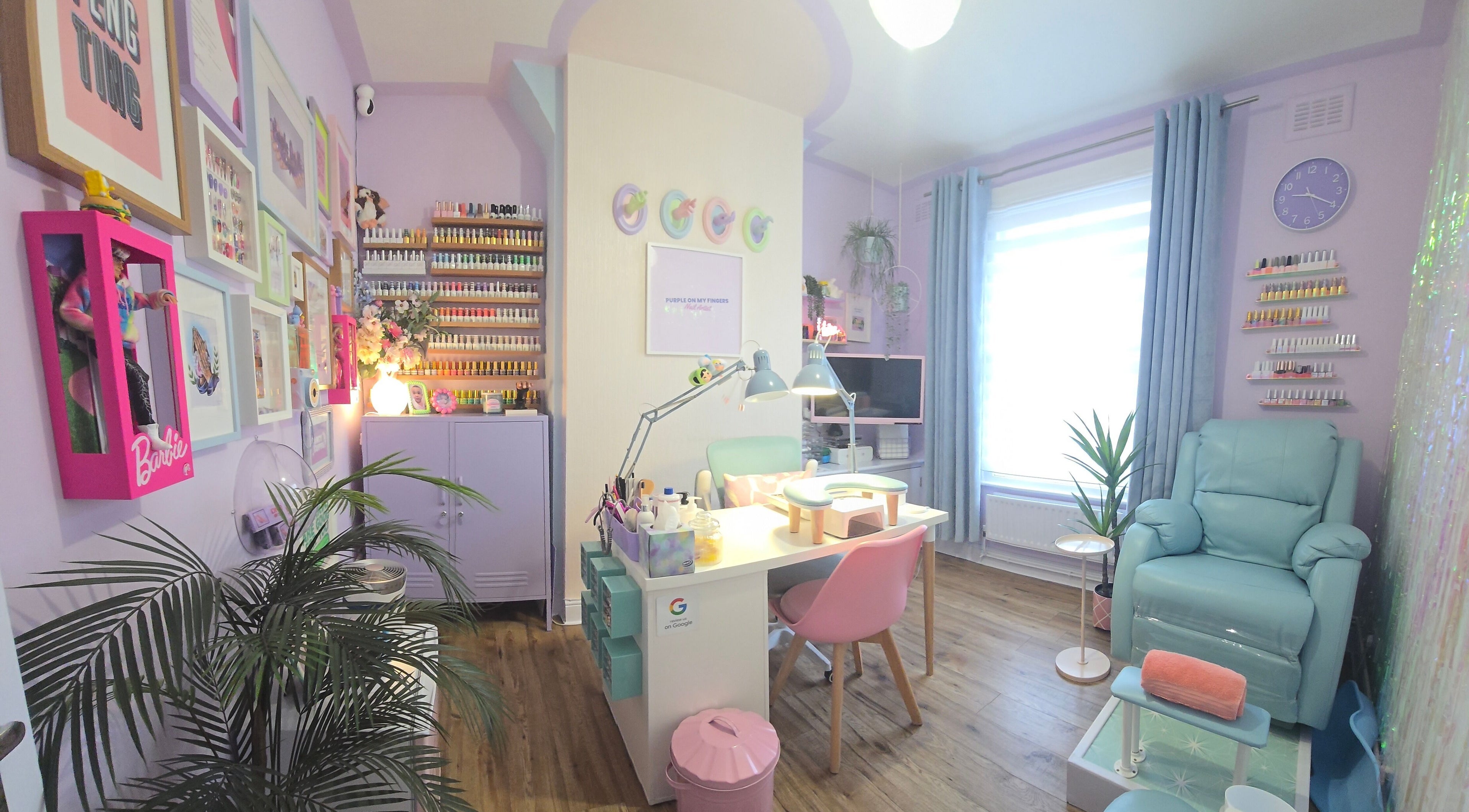 Interior of Purple On My Fingers nail salon in London, England, GB with pastel decor and manicure stations.