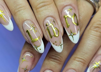 Elegant nail art with gold zodiac design at Purple On My Fingers, London, England, GB.