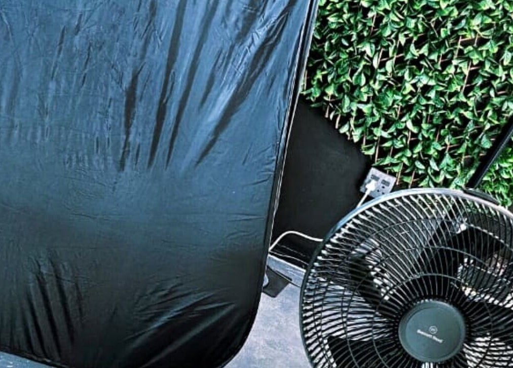 Relaxation space at Ries de Beauté, Emalahleni, Mpumalanga, ZA with lush greenery and fan.