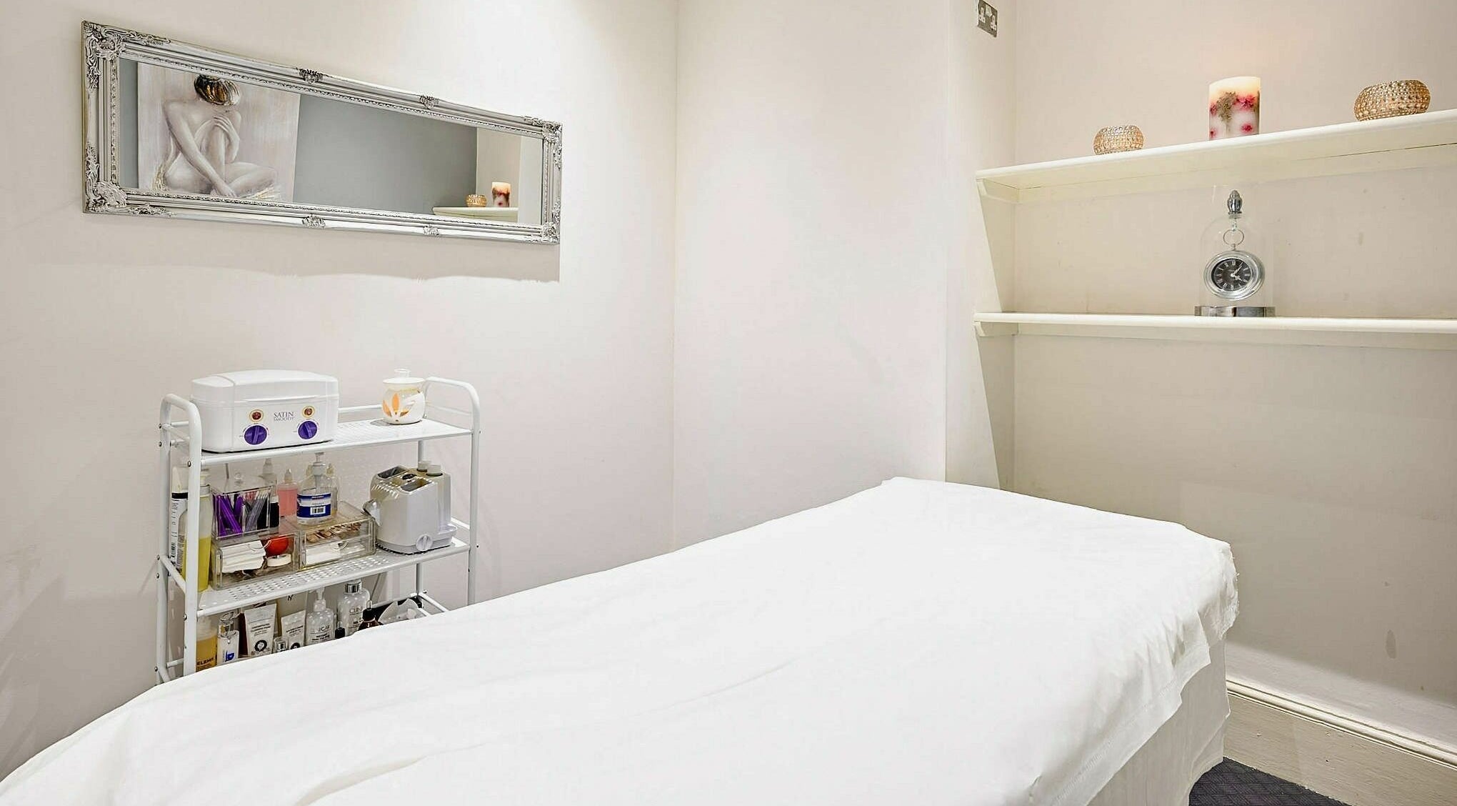 Serene treatment room at Enrich Beauty, Northampton, England, GB, offering a relaxing spa experience.