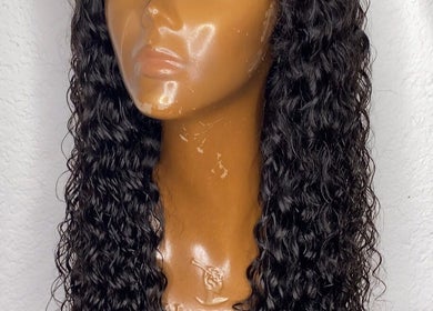 Curly hair wig displayed at Weave Darling Luxury Hair Boutique, Kingston, St. Andrew Parish, JM.