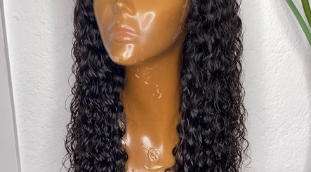 Curly hair wig displayed at Weave Darling Luxury Hair Boutique, Kingston, St. Andrew Parish, JM.