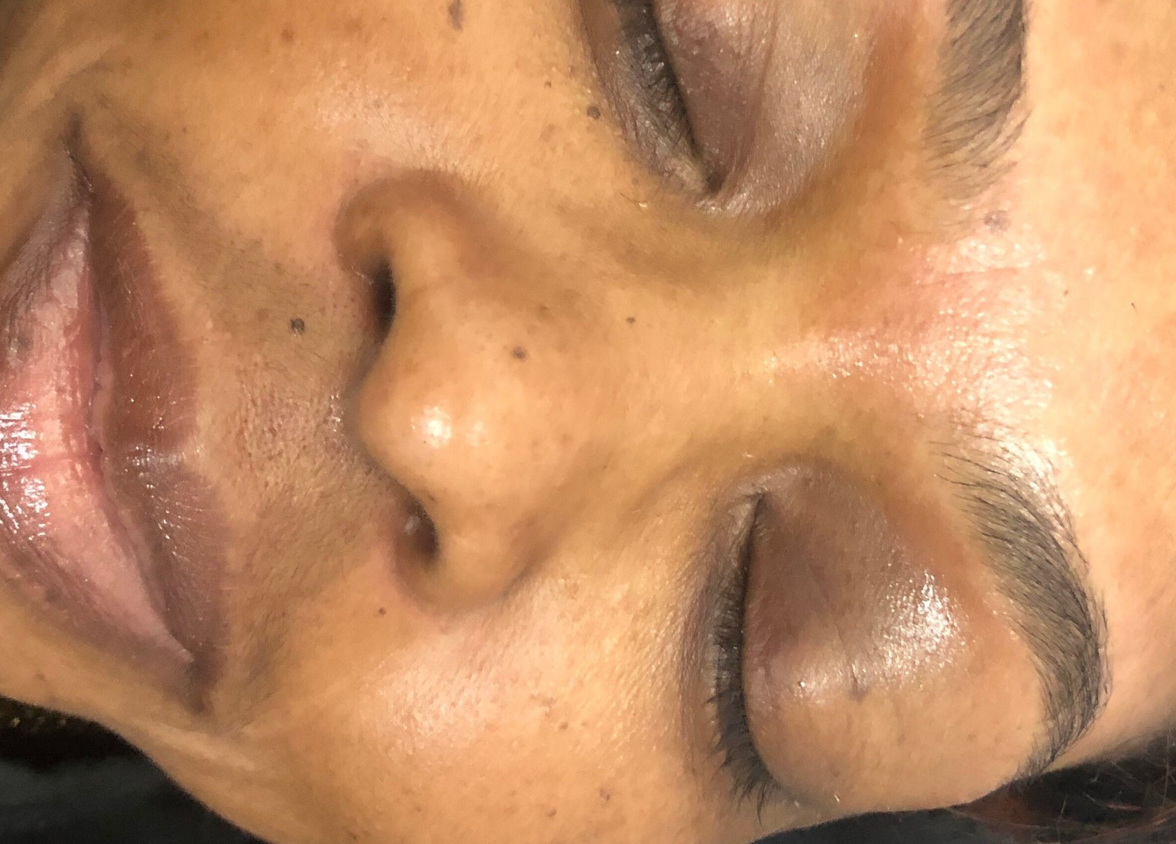 Close-up of a serene, freshly treated face at Feminine Chemistry in Portmore, St. Catherine Parish, JM.