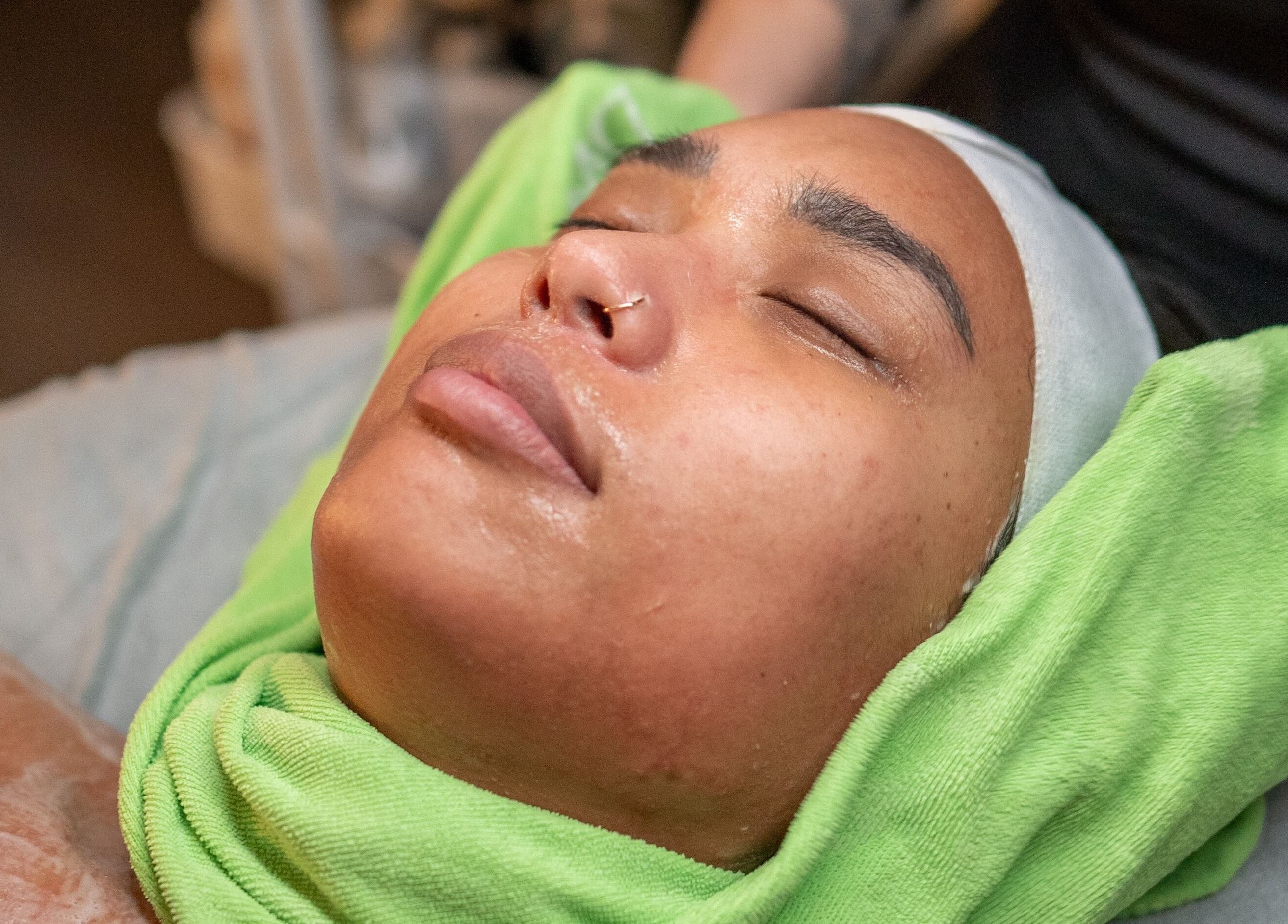 Facial treatment at Skinmethods in West Warwick, Rhode Island, US shows relaxation and rejuvenation.