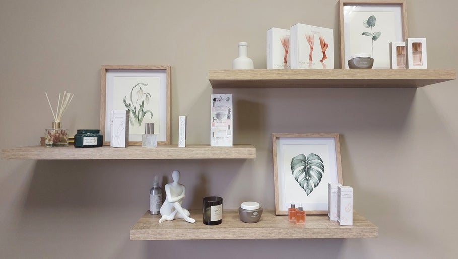 Stylish beauty products on wooden shelves at Nails by Anja, Windhoek, Khomas Region, NA.