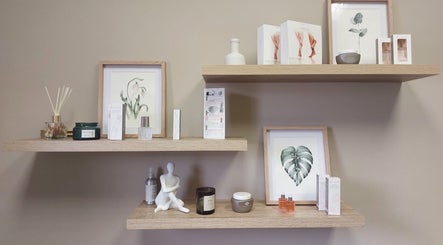 Stylish beauty products on wooden shelves at Nails by Anja, Windhoek, Khomas Region, NA.