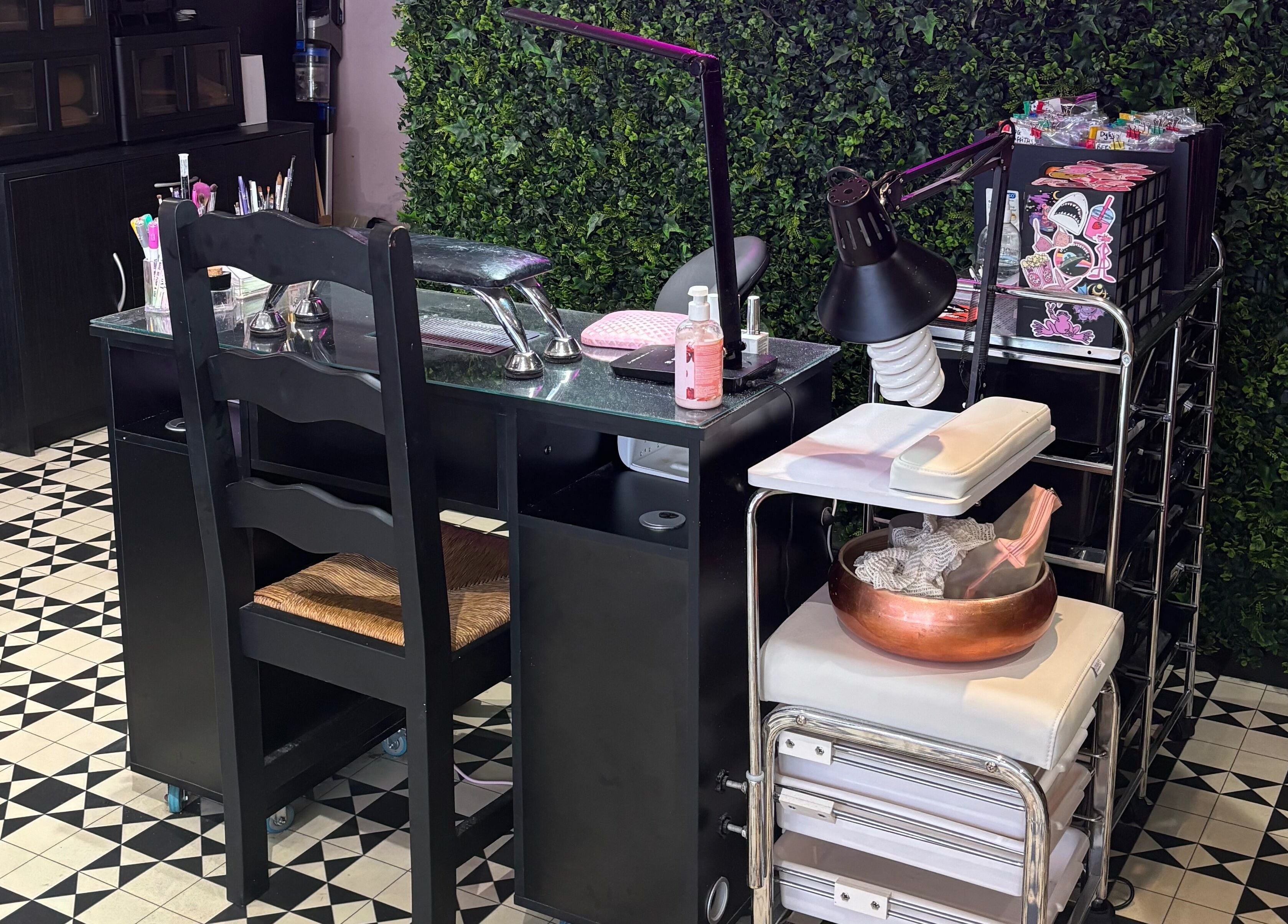 Modern nail station at Creative Claws Salon and Training Academy, Holyhead, Wales, GB with chic decor.