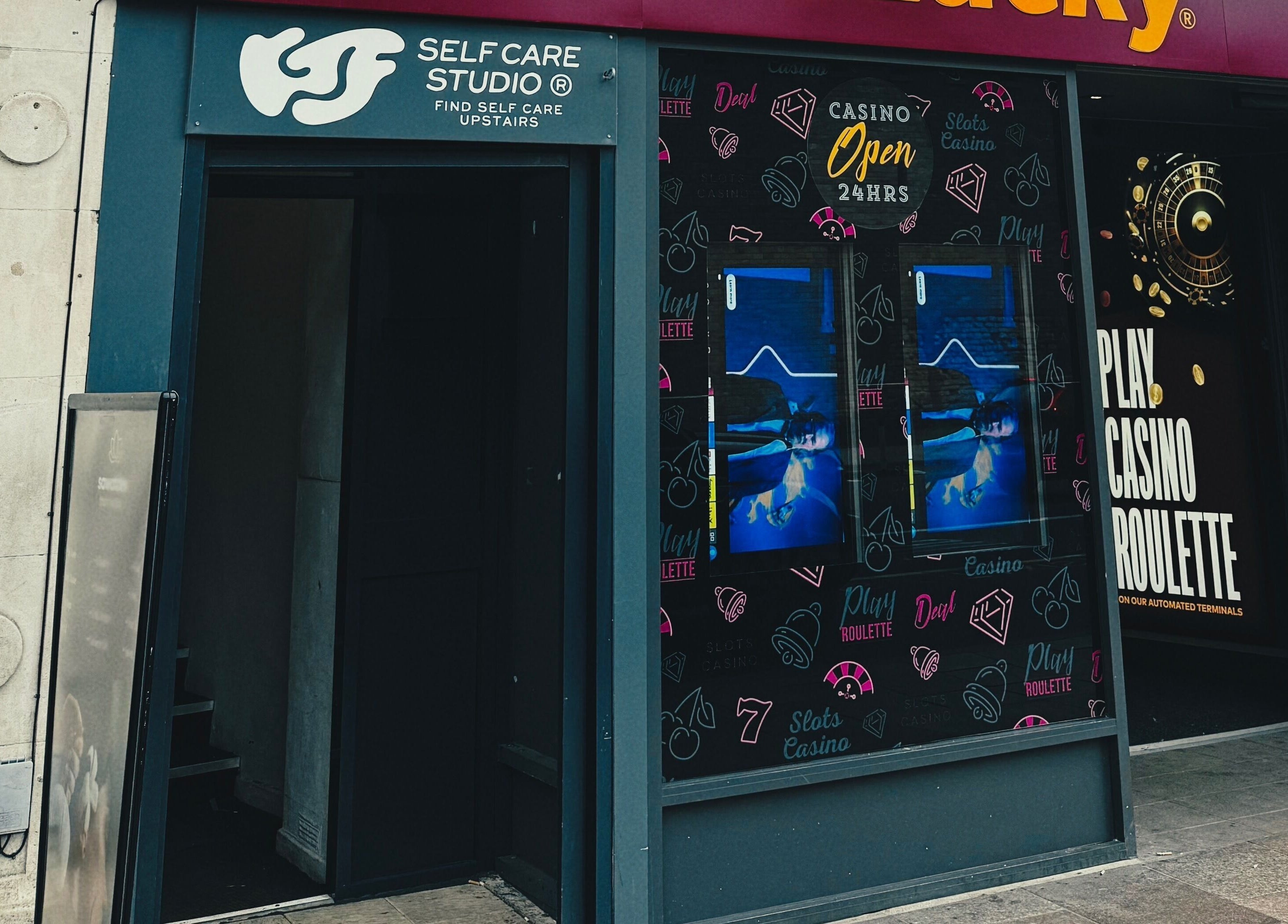 Entrance to KTF Self Care Studio in Cardiff, Wales, GB, showcasing unique signage and inviting atmosphere.