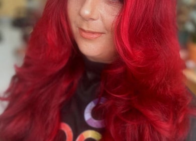Vibrant red hair styled at KTF Self Care Studio in Cardiff, Wales, GB. Perfect spot for a fresh new look.