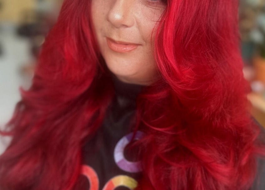 Vibrant red hair styled at KTF Self Care Studio in Cardiff, Wales, GB. Perfect spot for a fresh new look.