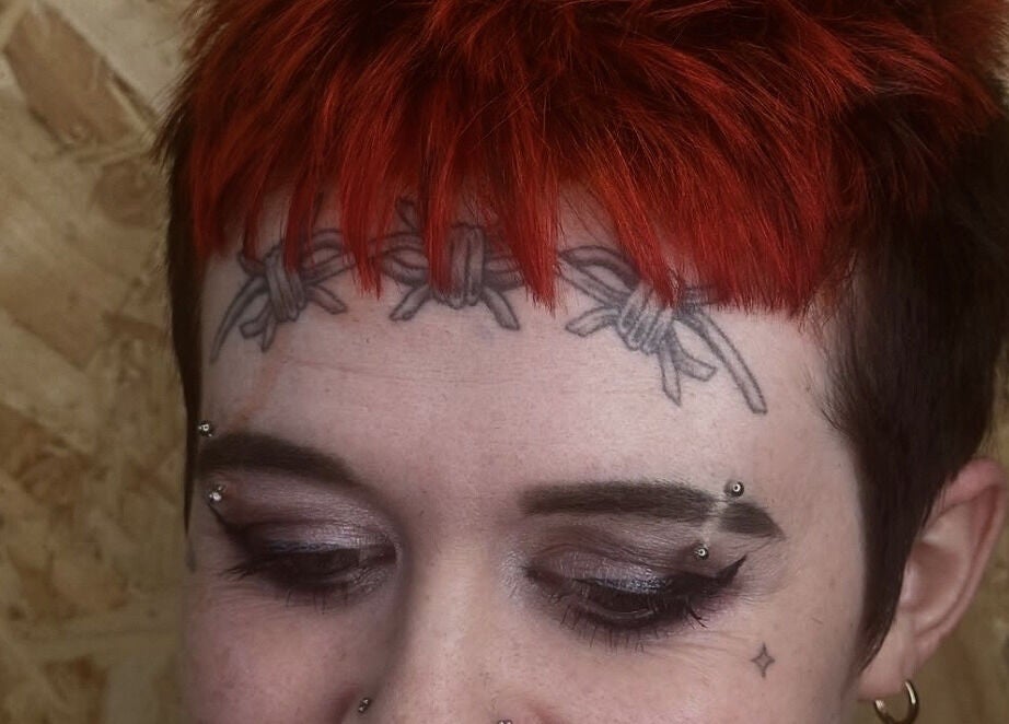 Close-up of unique forehead tattoo at KTF Self Care Studio, Cardiff, Wales, GB.