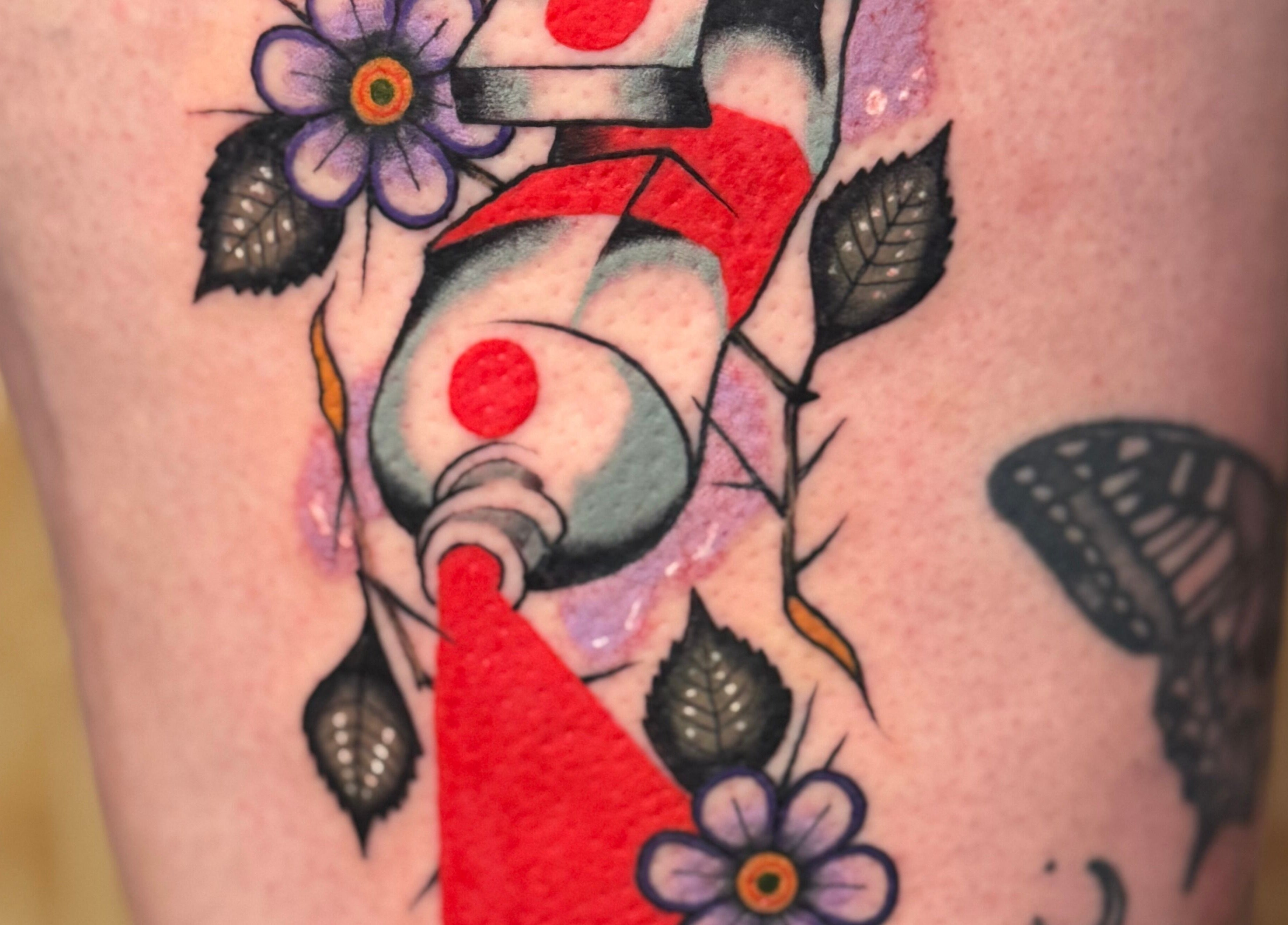 Unique floral and abstract tattoo design at KTF Self Care Studio, Cardiff, Wales, GB.