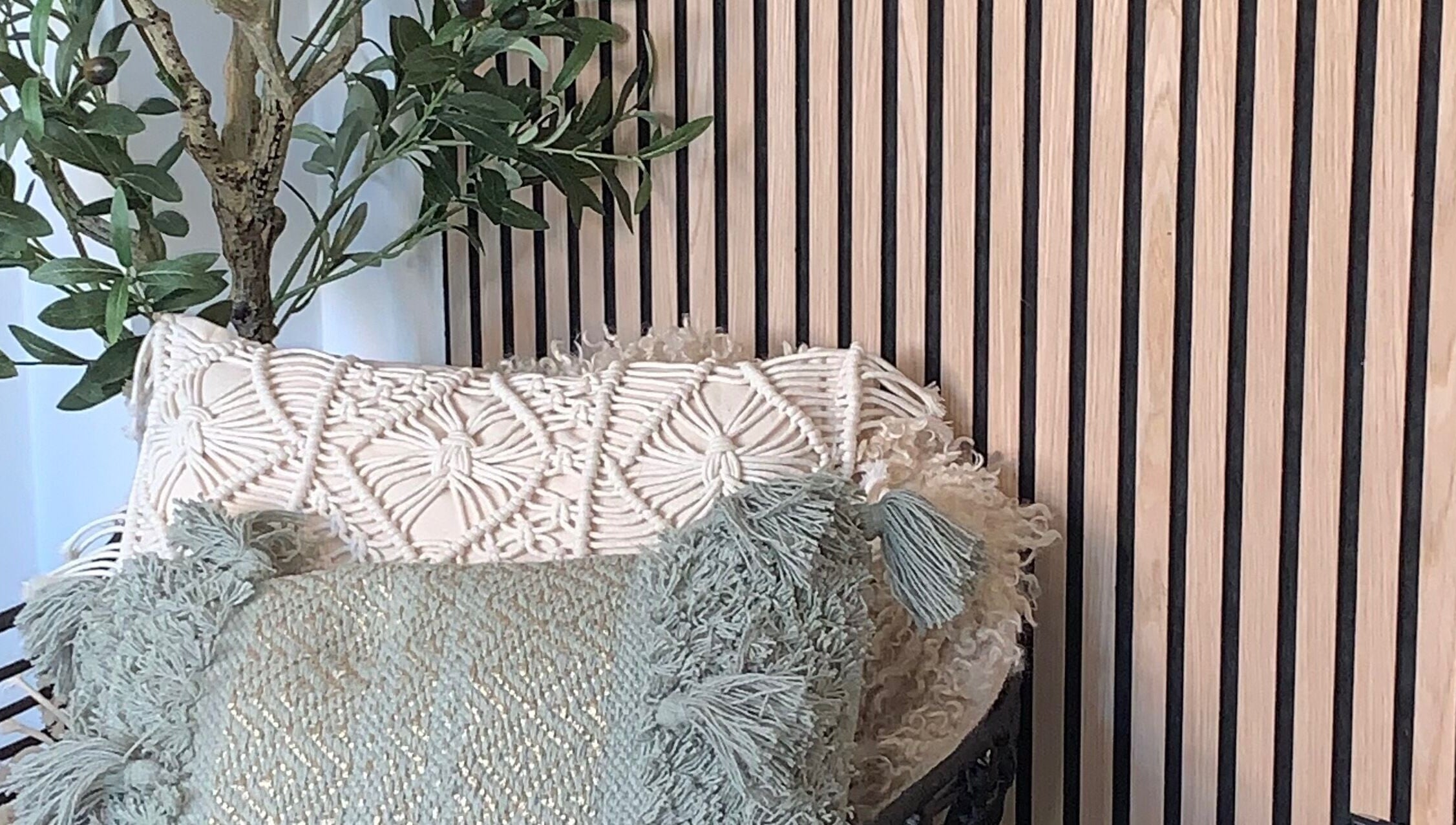 Cozy seating with textured cushions at Lily May Make-up Artist, Leeds, England, GB.