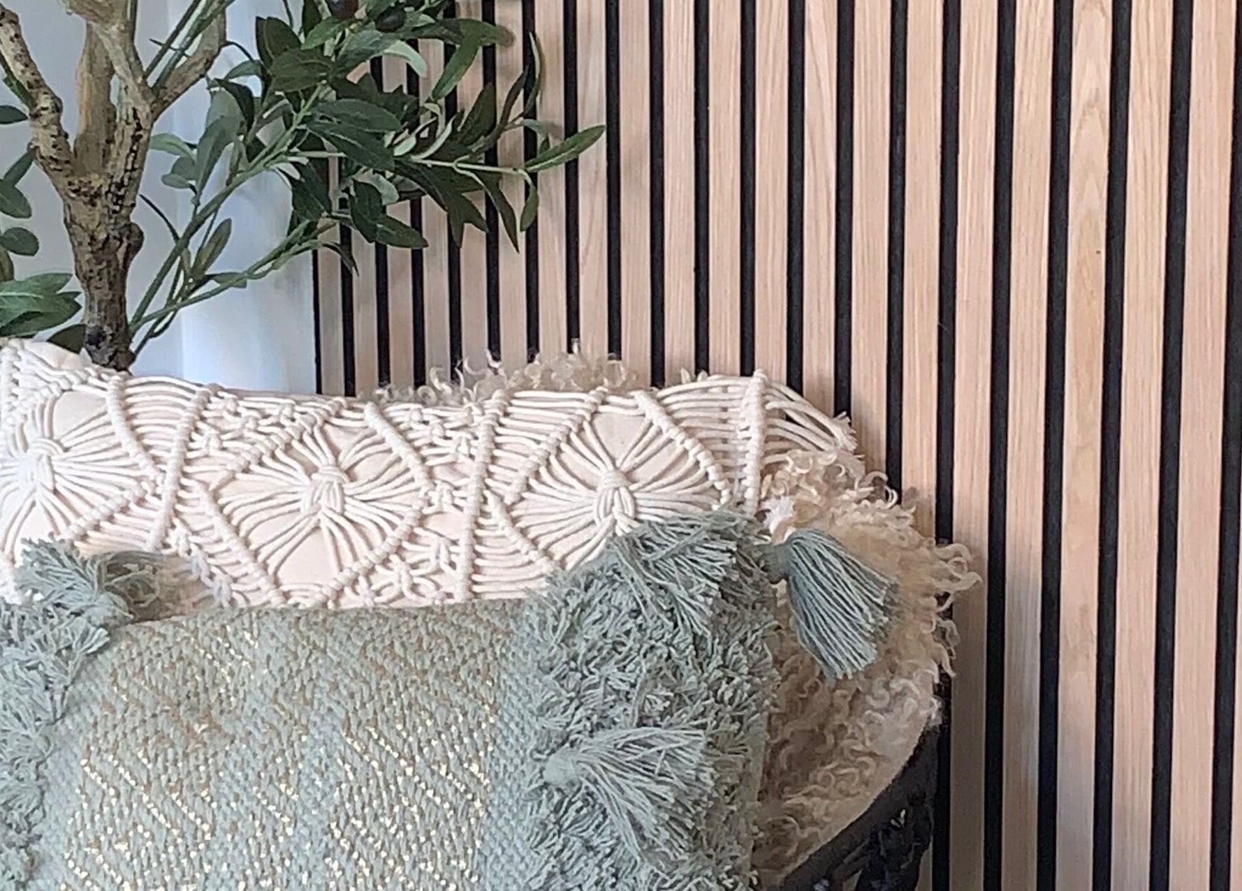 Cozy seating with textured cushions at Lily May Make-up Artist, Leeds, England, GB.