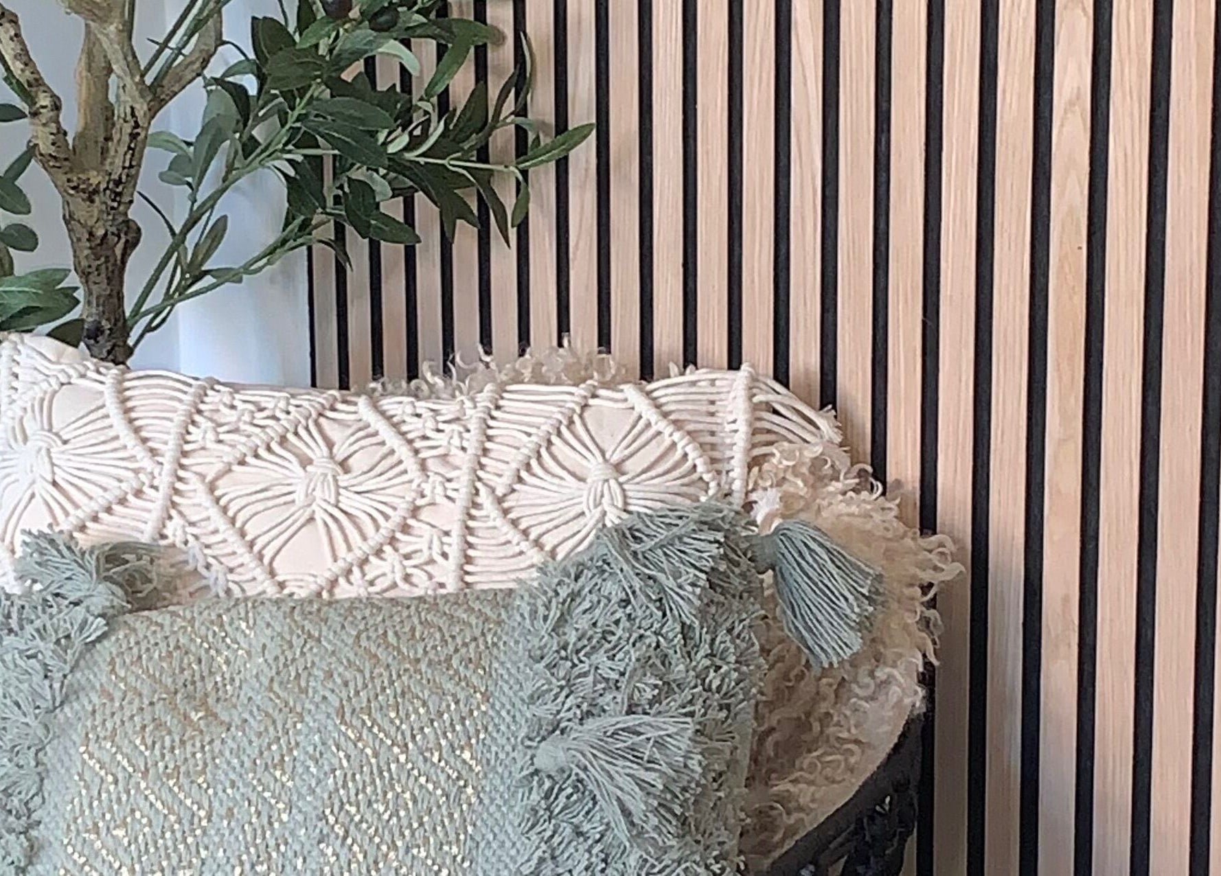 Cozy seating with textured cushions at Lily May Make-up Artist, Leeds, England, GB.