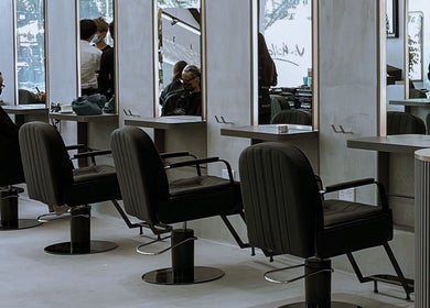 Modern, elegant salon chairs and mirrors at The Hair Lounge, Singapore, Singapore, SG.