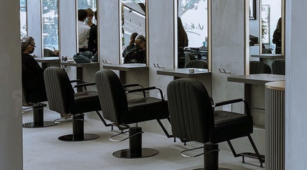 Modern, elegant salon chairs and mirrors at The Hair Lounge, Singapore, Singapore, SG.