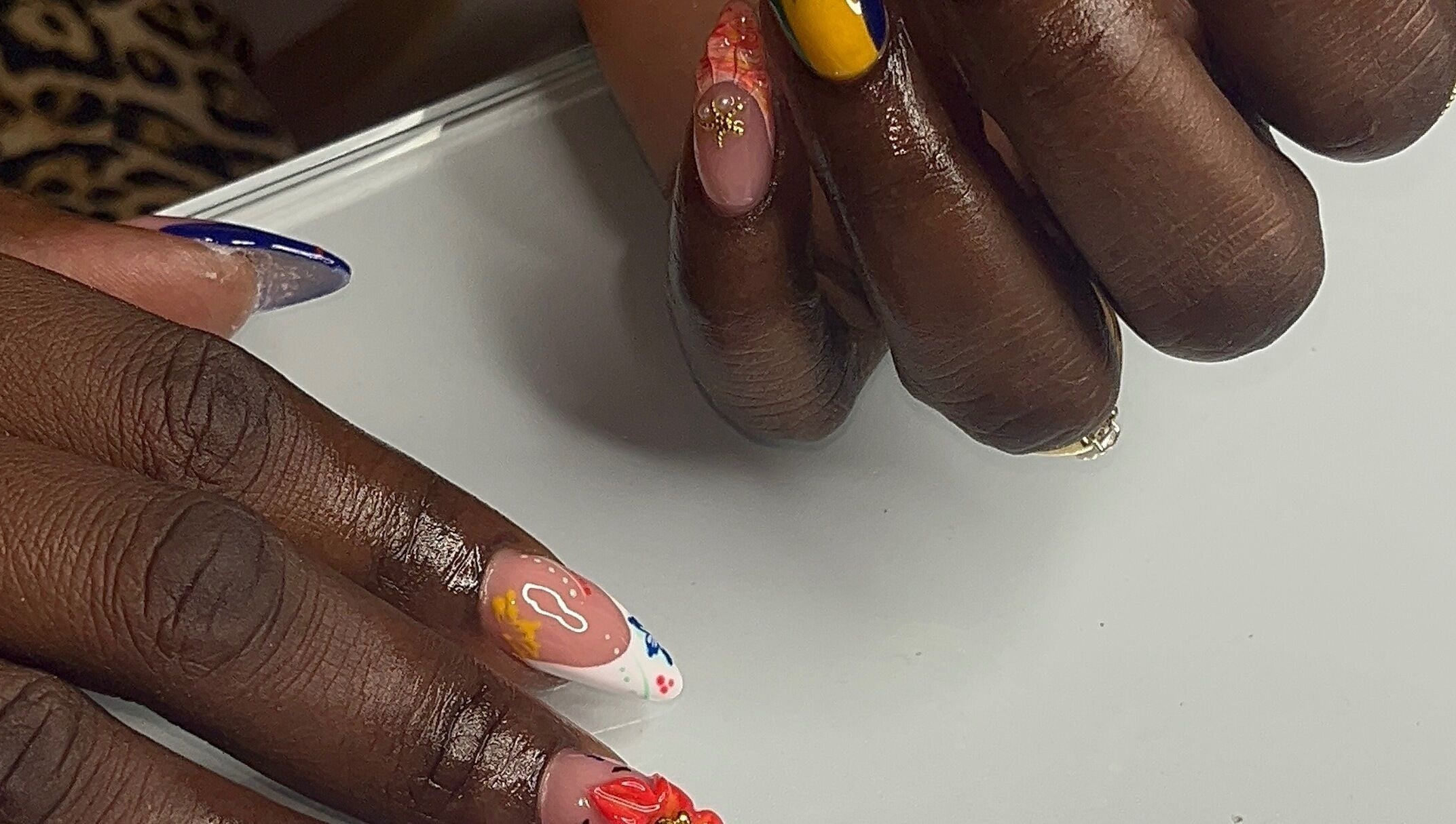 Colorful nail art at Nail Essentialsss in Bridgetown, Saint Michael, BB showcasing creative designs.