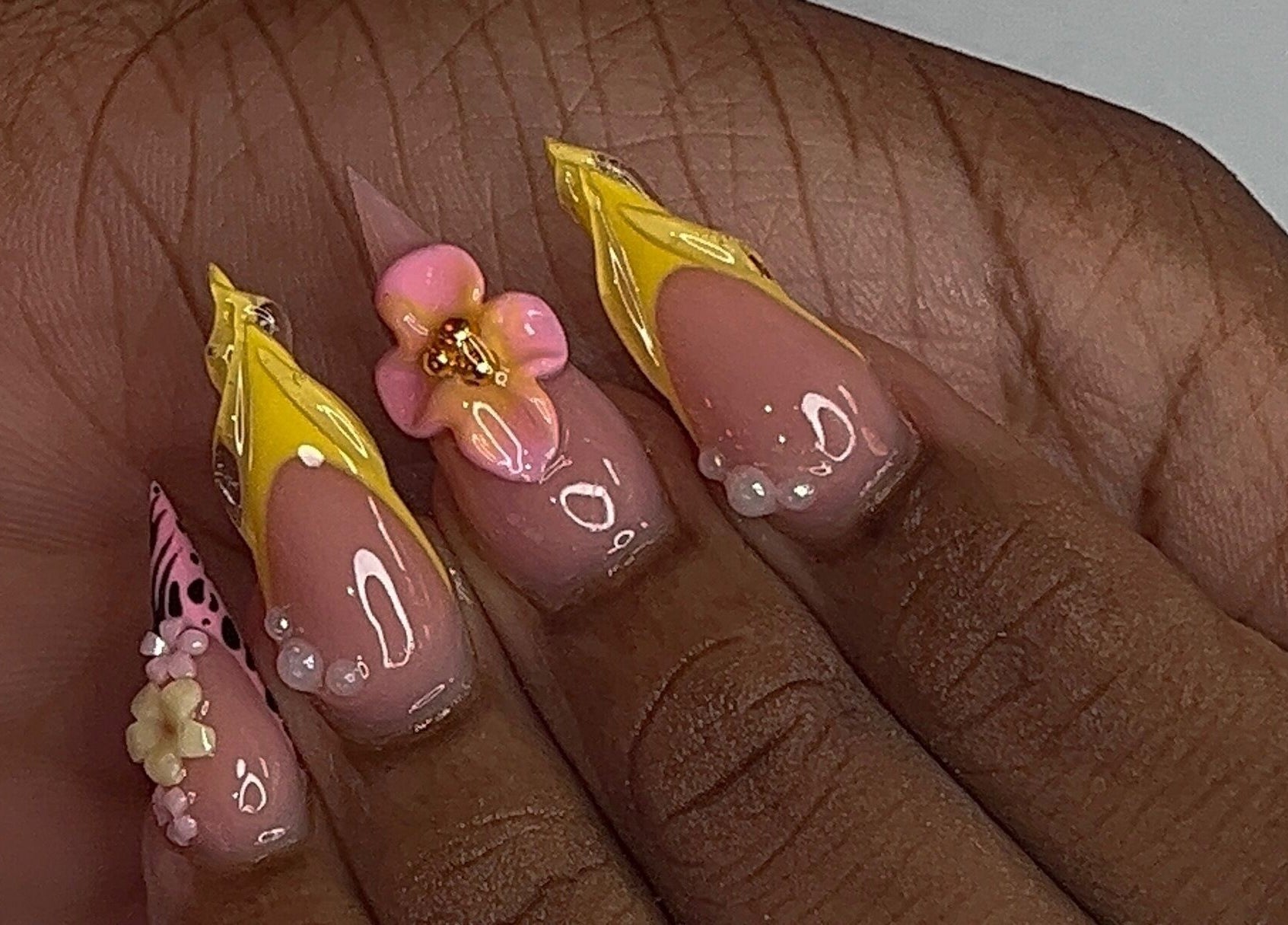 Elegant floral nail art with 3D flowers at Nail Essentialsss, Bridgetown, Saint Michael, BB.