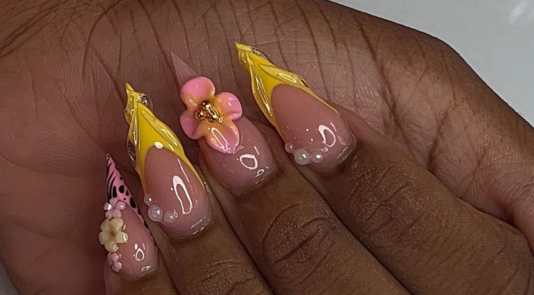 Elegant floral nail art with 3D flowers at Nail Essentialsss, Bridgetown, Saint Michael, BB.