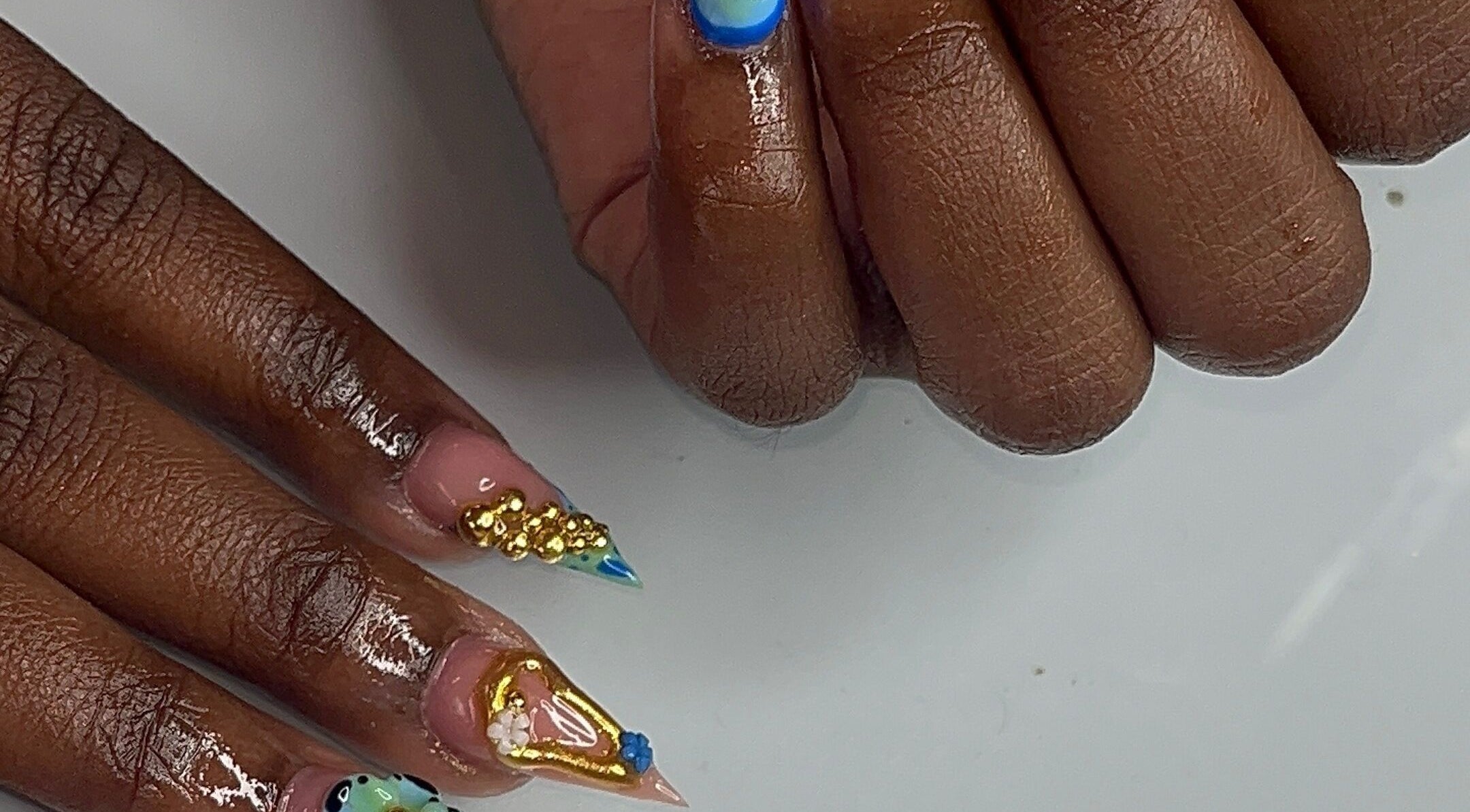 Intricate nail art by Nail Essentialsss in Bridgetown, Saint Michael, BB highlighting vibrant designs and colors.