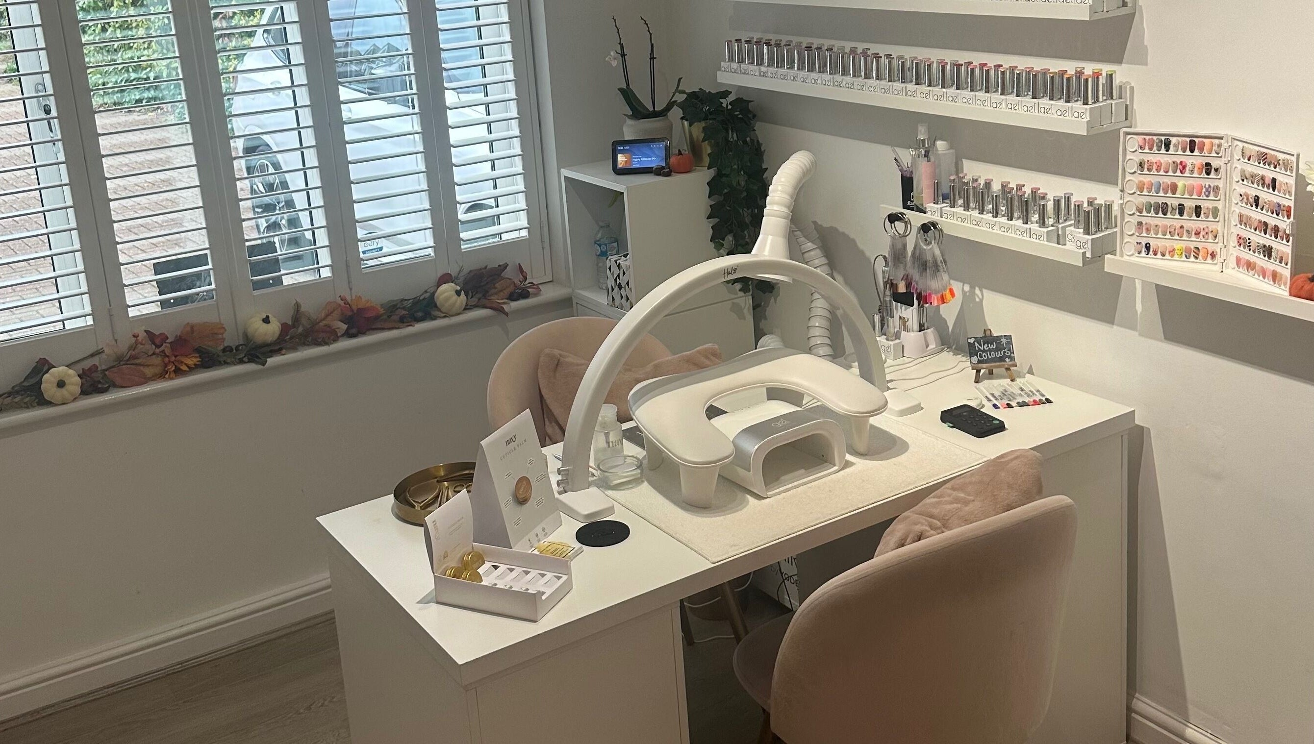 Chic nail station at St Neots Nail Fairy, St Neots, England, GB with polishes and tools neatly displayed.