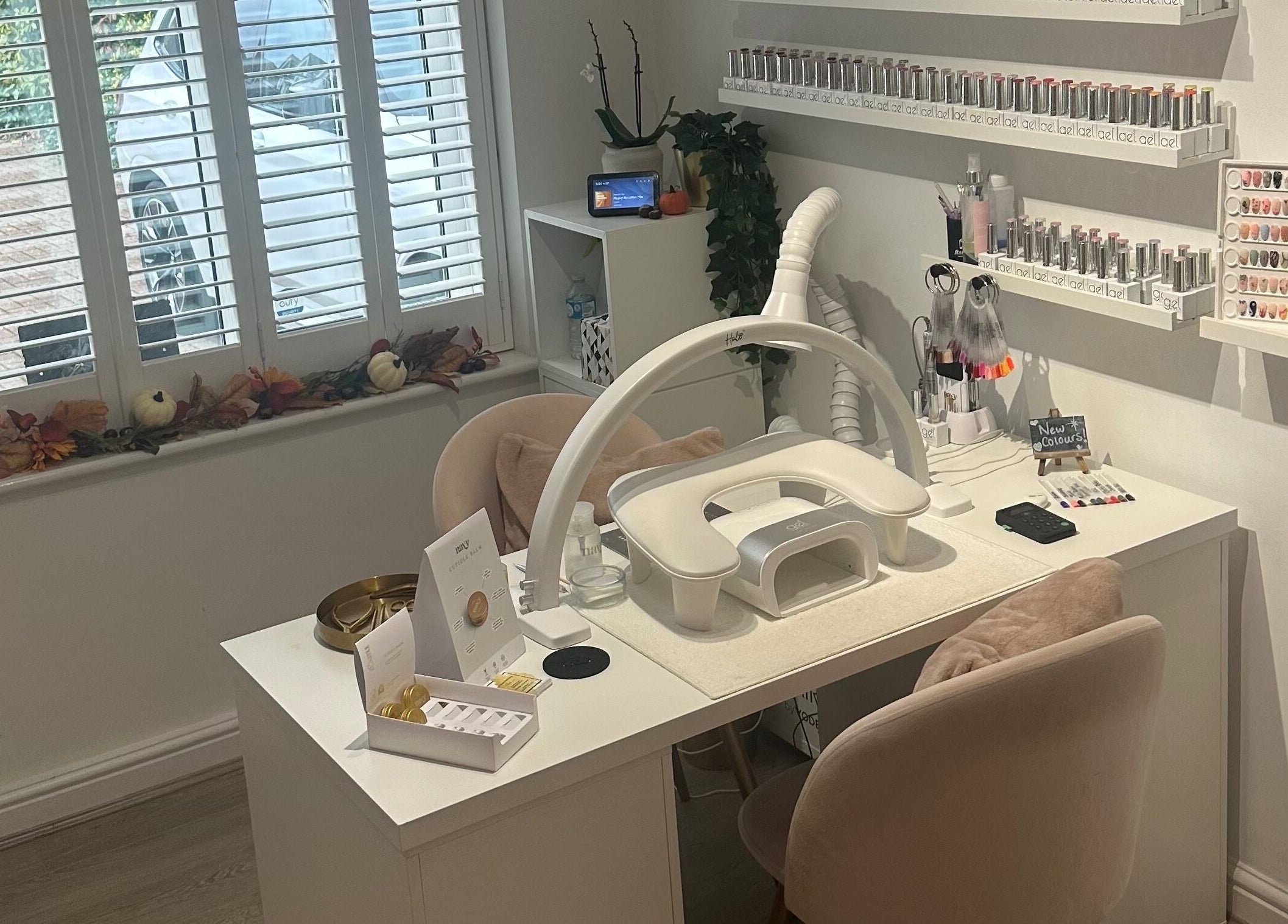 Chic nail station at St Neots Nail Fairy, St Neots, England, GB with polishes and tools neatly displayed.