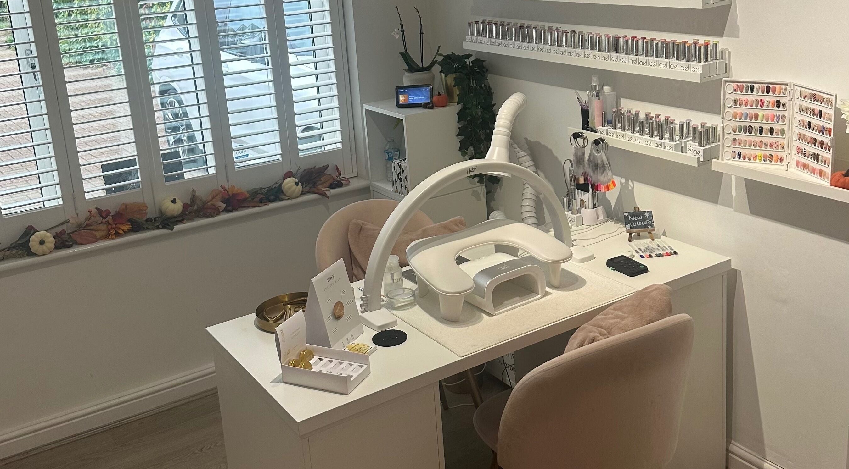 Chic nail station at St Neots Nail Fairy, St Neots, England, GB with polishes and tools neatly displayed.