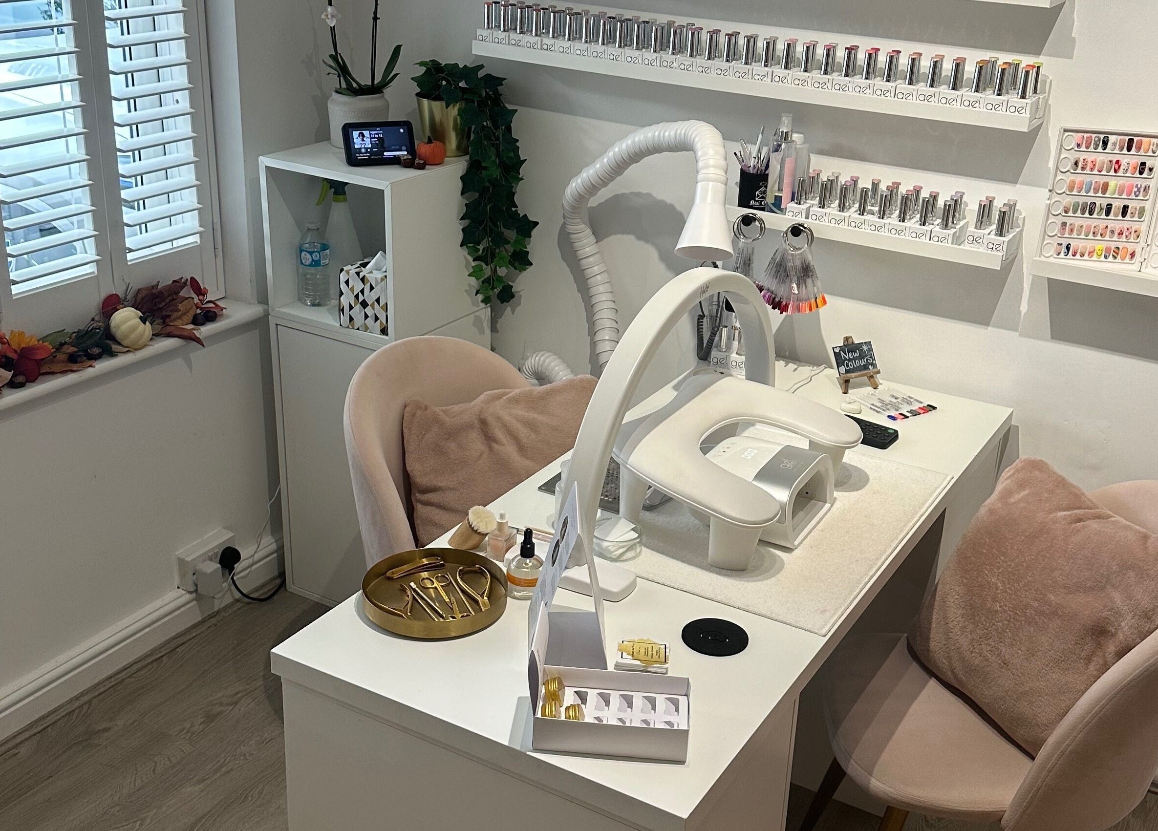 Cozy nail station at St Neots Nail Fairy, St Neots, England, GB with elegant decor and nail polish display.