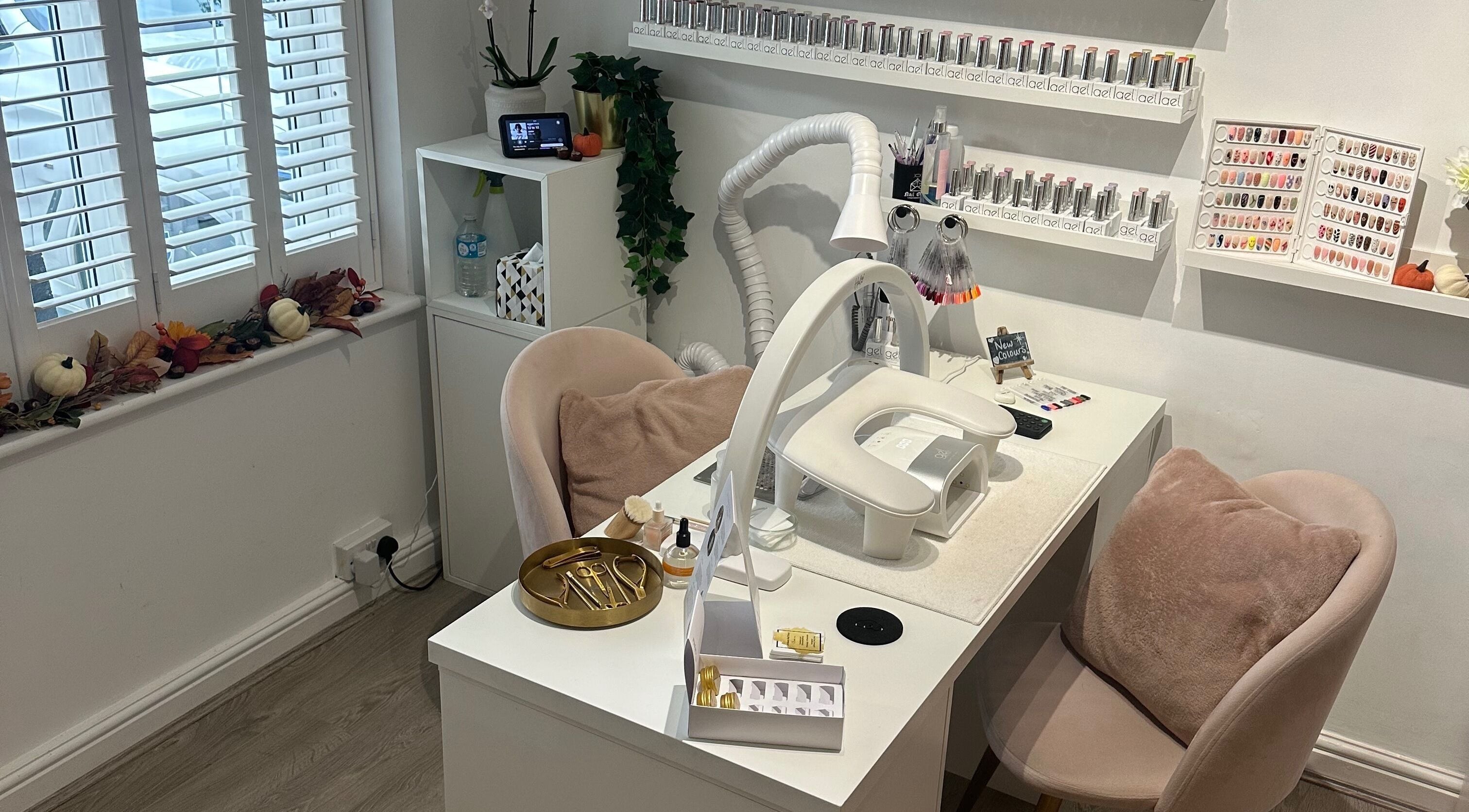 Cozy nail station at St Neots Nail Fairy, St Neots, England, GB with elegant decor and nail polish display.